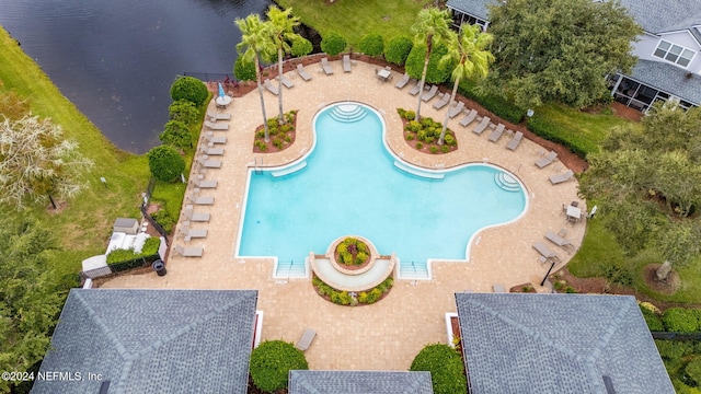 view of swimming pool with a water view