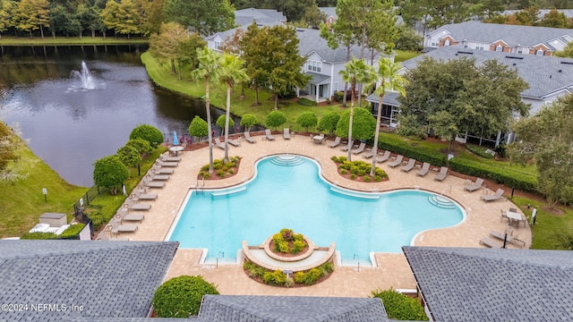 view of pool with a water view