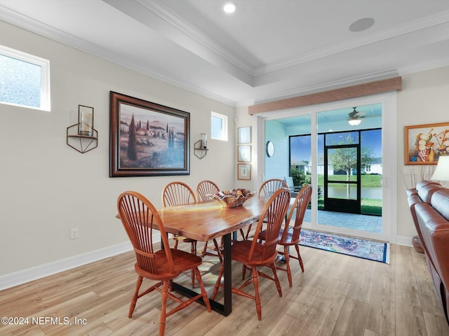 dining area with plenty of natural light, light hardwood / wood-style floors, and ornamental molding