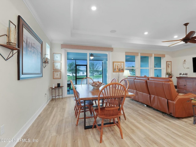 dining room with light hardwood / wood-style floors, ceiling fan, and ornamental molding