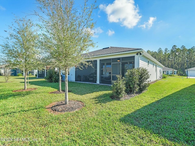 view of yard featuring a sunroom