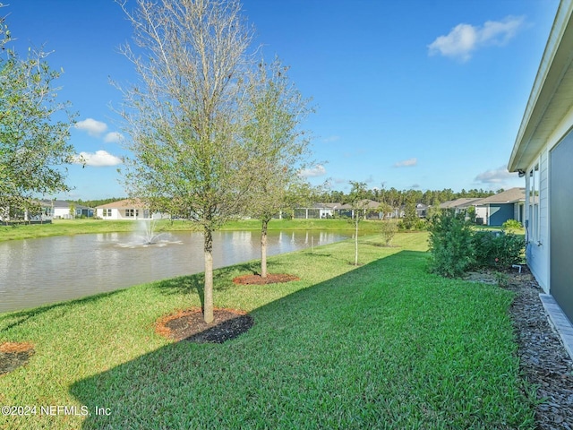 view of yard with a water view