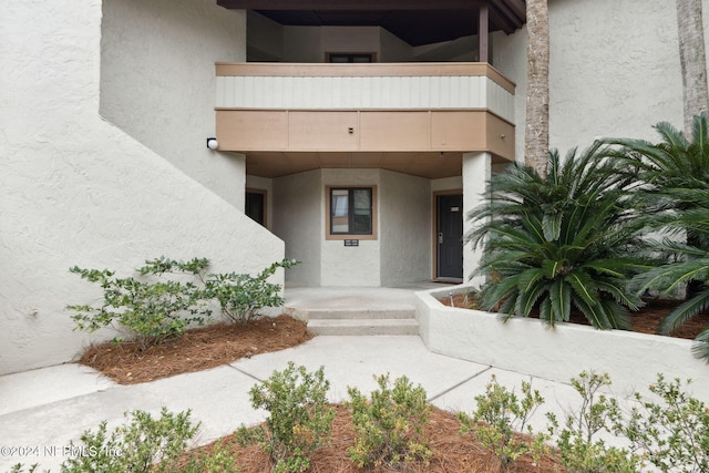 doorway to property featuring a balcony