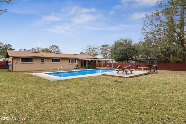 view of swimming pool featuring a gazebo and a lawn