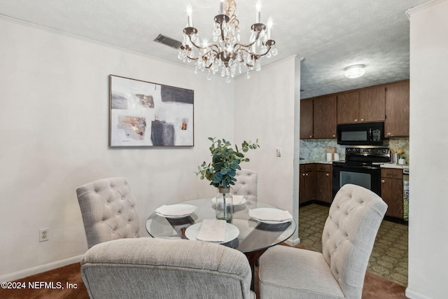 dining room with a notable chandelier, crown molding, and a textured ceiling