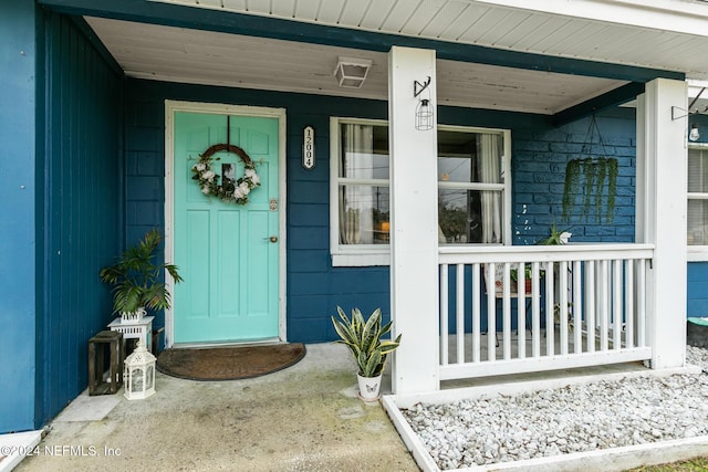 entrance to property with a porch