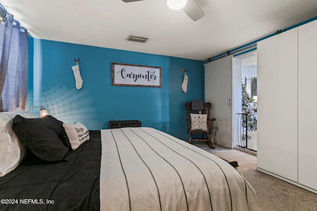 carpeted bedroom with ceiling fan