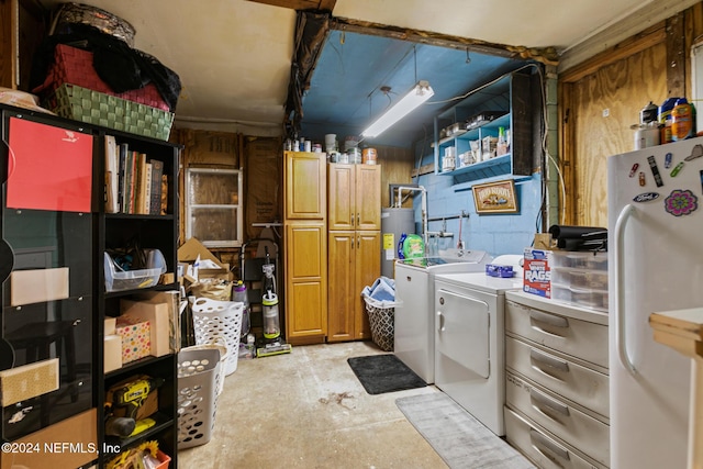 clothes washing area with independent washer and dryer and water heater