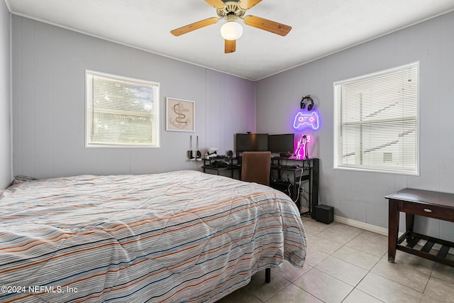 tiled bedroom with ceiling fan