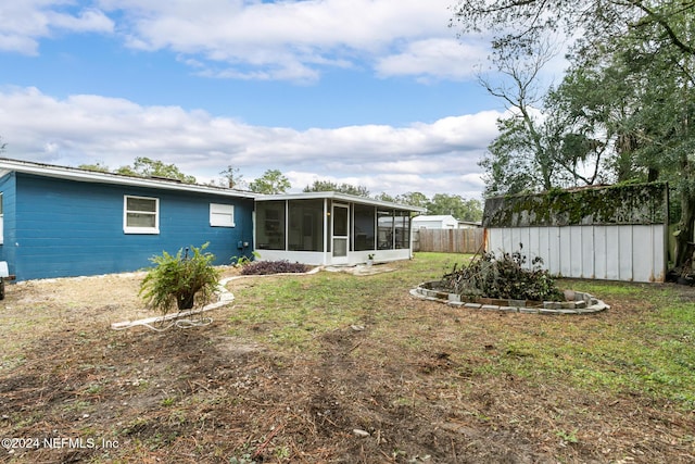 view of yard featuring a sunroom