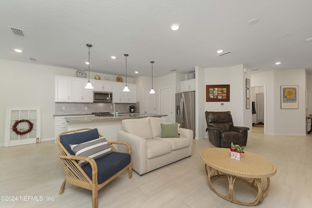 living room featuring a textured ceiling