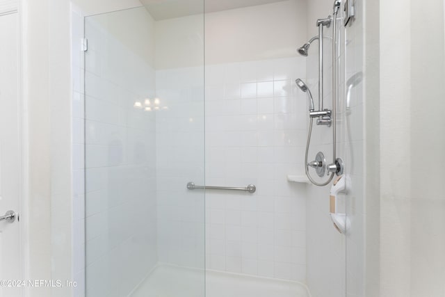 bathroom with tiled shower