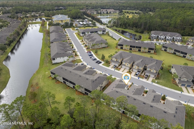 drone / aerial view with a water view