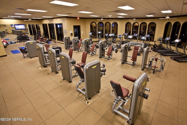 workout area featuring a paneled ceiling