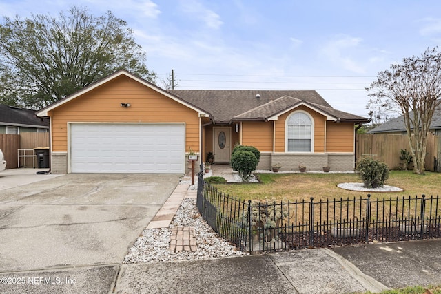 ranch-style house featuring a front yard and a garage