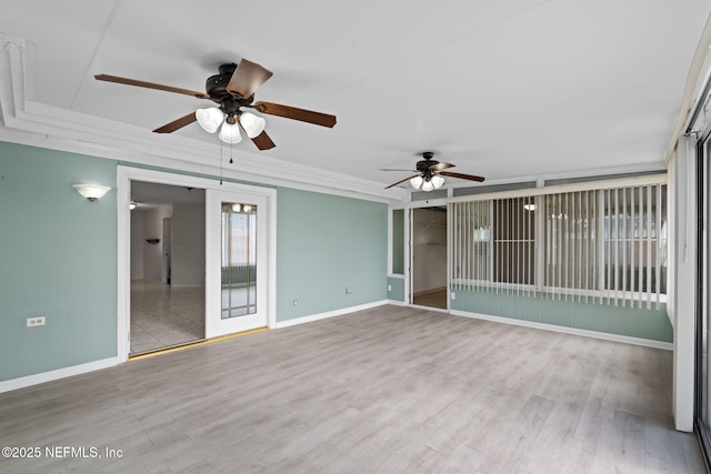 spare room with ceiling fan and light hardwood / wood-style flooring