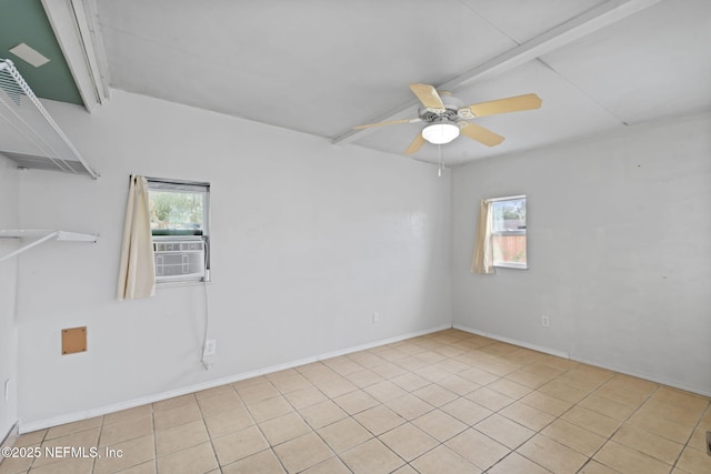 spare room with cooling unit, ceiling fan, light tile patterned floors, and a wealth of natural light