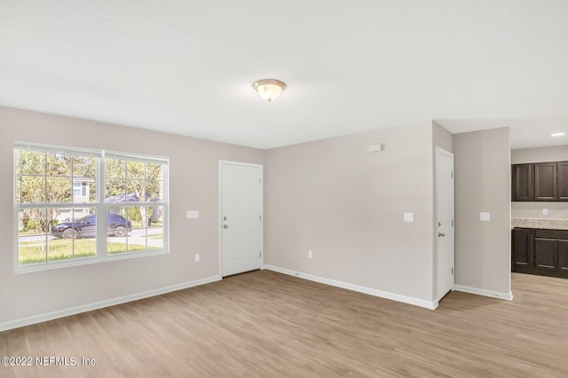 spare room featuring light wood-type flooring