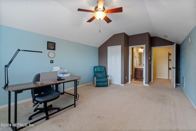 home office with light carpet, ceiling fan, and lofted ceiling