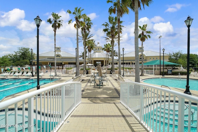 view of swimming pool featuring a patio area