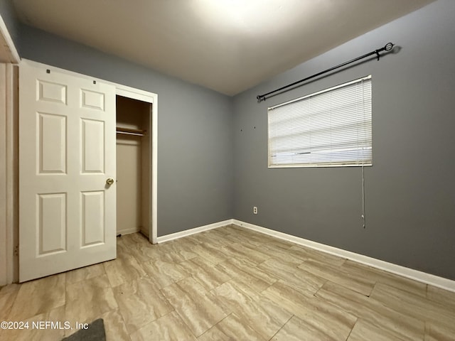 unfurnished bedroom with a closet