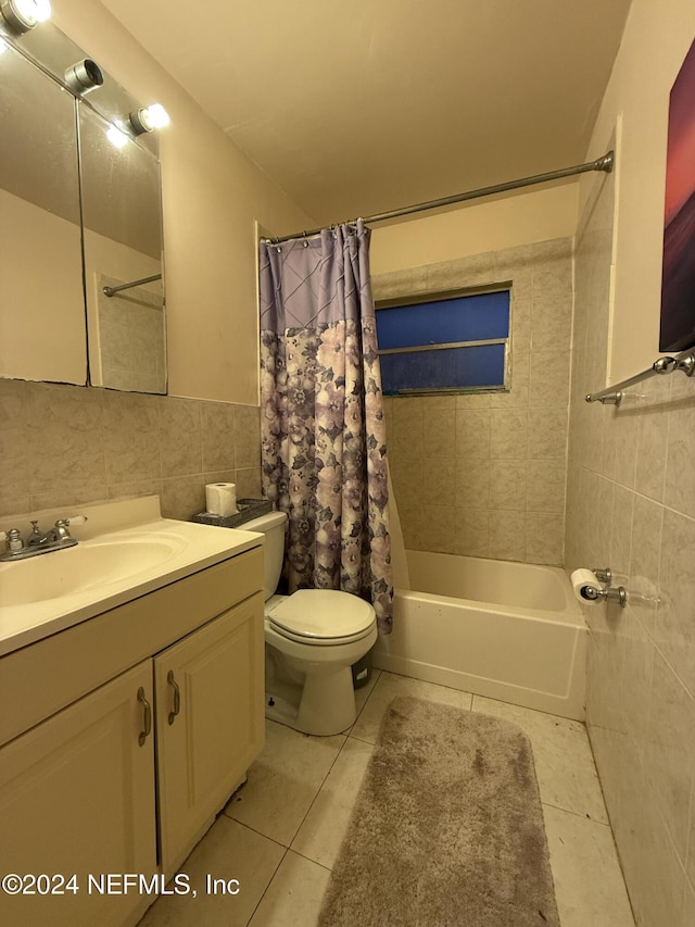 full bathroom with vanity, tile patterned flooring, toilet, shower / bathtub combination with curtain, and tile walls