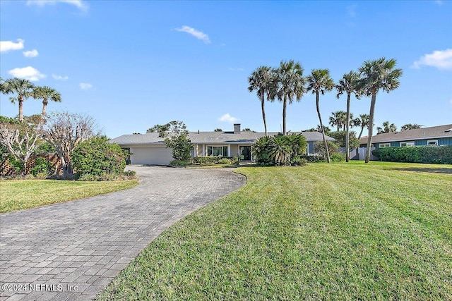 ranch-style house featuring a front lawn