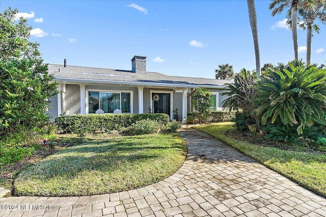 ranch-style home with a front yard