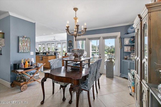 dining room featuring french doors, ceiling fan with notable chandelier, crown molding, sink, and light tile patterned floors