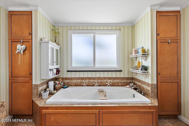 bathroom with a tub to relax in and ornamental molding