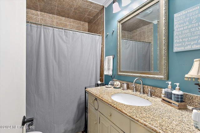 bathroom with vanity and curtained shower