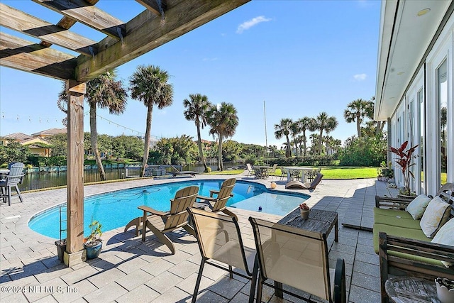 view of swimming pool featuring a water view, a pergola, and a patio