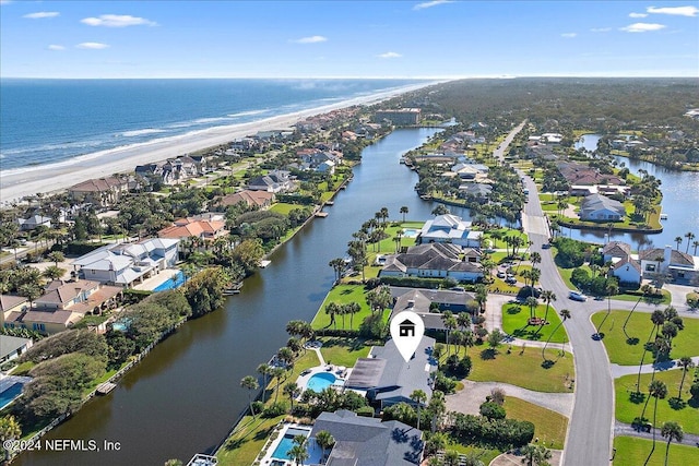 drone / aerial view with a water view and a view of the beach