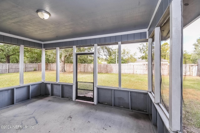 unfurnished sunroom with plenty of natural light