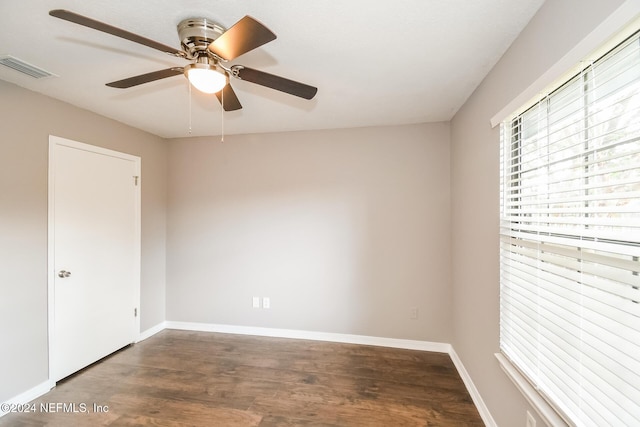 unfurnished room featuring ceiling fan and dark hardwood / wood-style floors