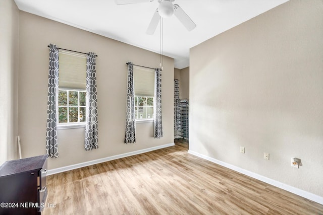 empty room featuring light hardwood / wood-style floors and ceiling fan