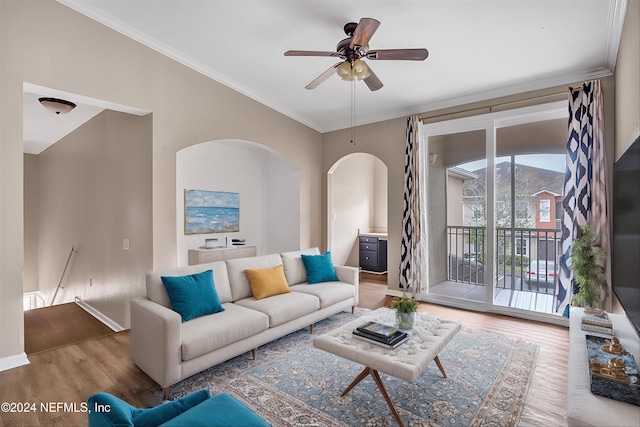 living room with ceiling fan, wood-type flooring, and crown molding
