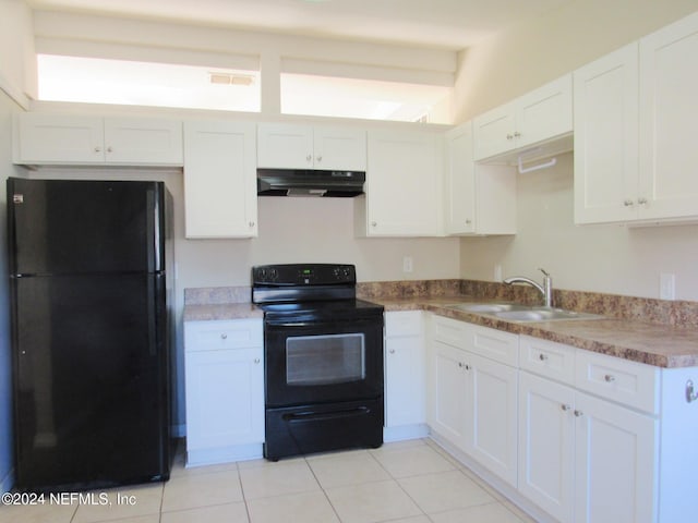 kitchen featuring black appliances, light tile patterned flooring, white cabinets, and sink