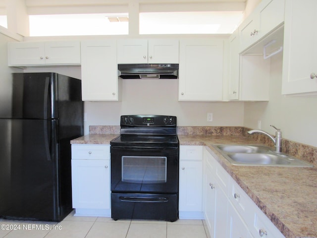 kitchen with black appliances, white cabinetry, and sink