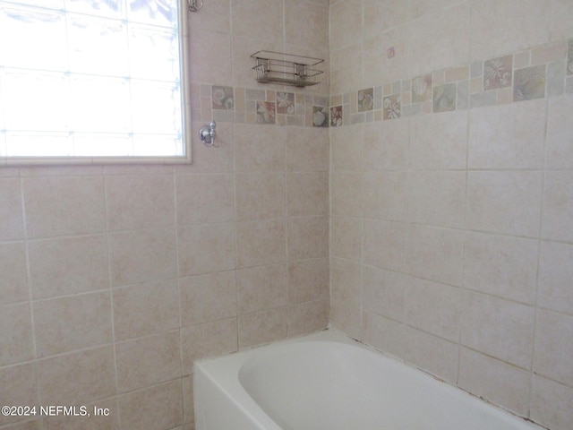 bathroom with a washtub