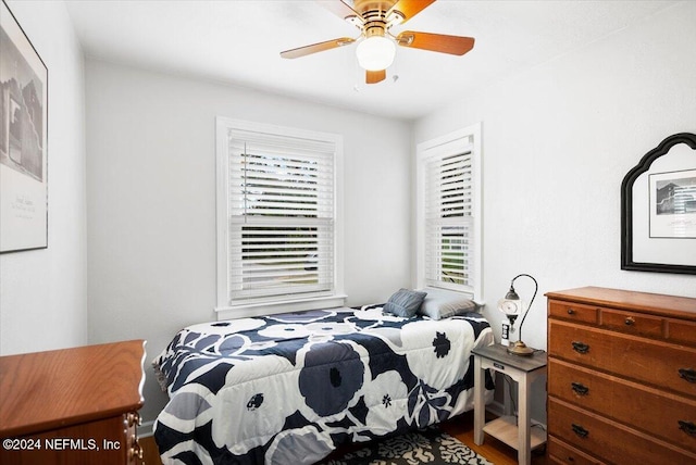 bedroom featuring wood-type flooring and ceiling fan