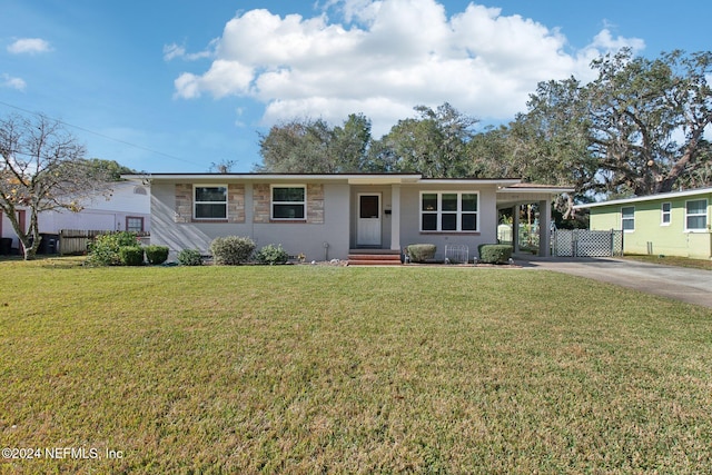 ranch-style house with a carport and a front yard