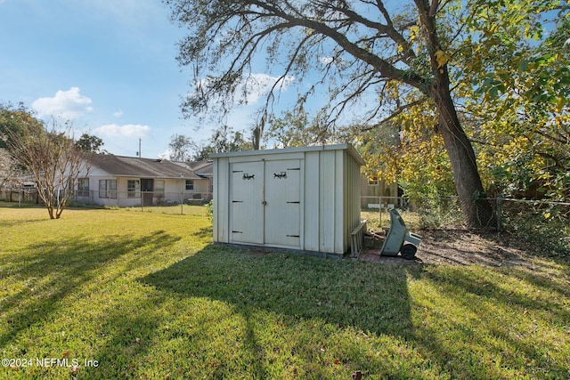 view of outbuilding featuring a yard