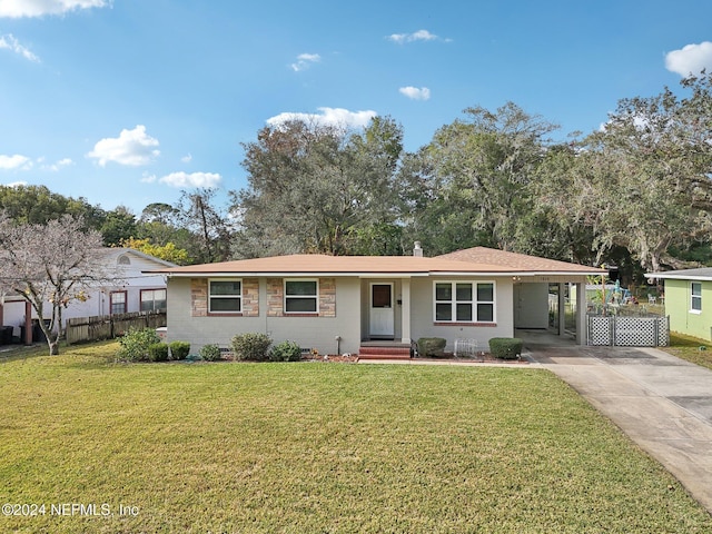 ranch-style house featuring a front yard and a carport