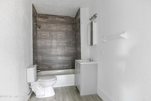 full bathroom featuring hardwood / wood-style floors, a textured ceiling, toilet, shower / tub combination, and vanity