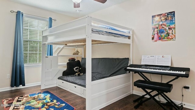 bedroom featuring ceiling fan and dark hardwood / wood-style floors