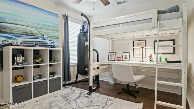 office area with ceiling fan and dark hardwood / wood-style flooring