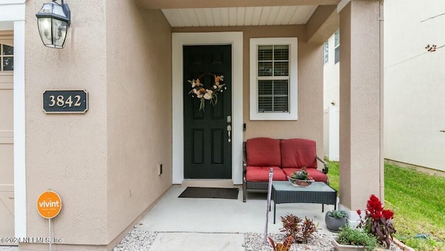 property entrance with covered porch