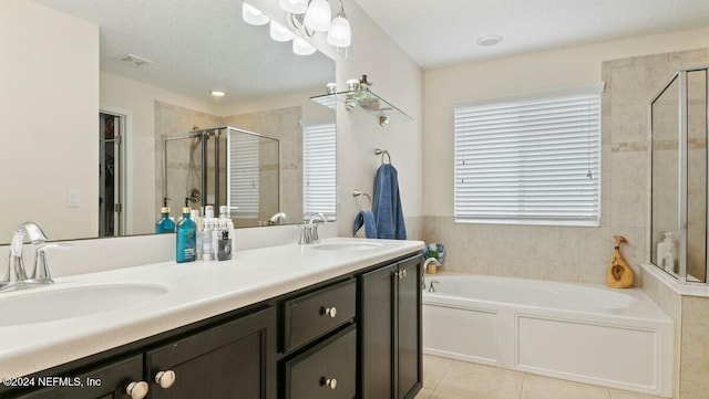 bathroom featuring separate shower and tub, tile patterned floors, and vanity