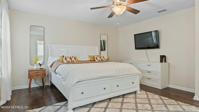 bedroom with hardwood / wood-style flooring and ceiling fan